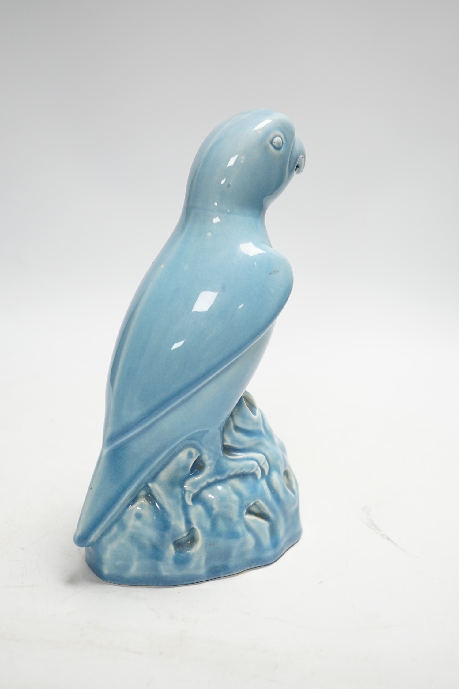 An Art Deco Mintons blue glazed parrot, 22cm high